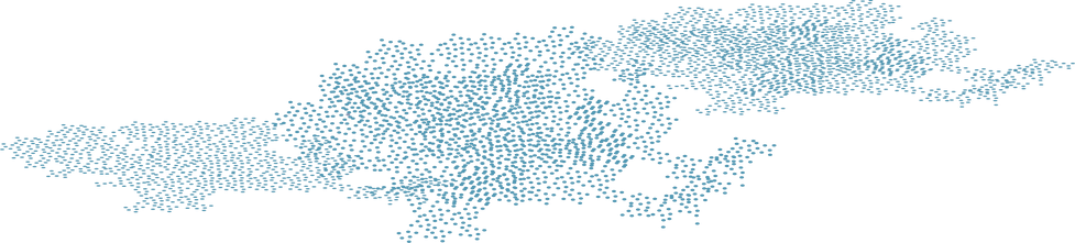 Blue cluster of dots in form of city at night, as seen from space.